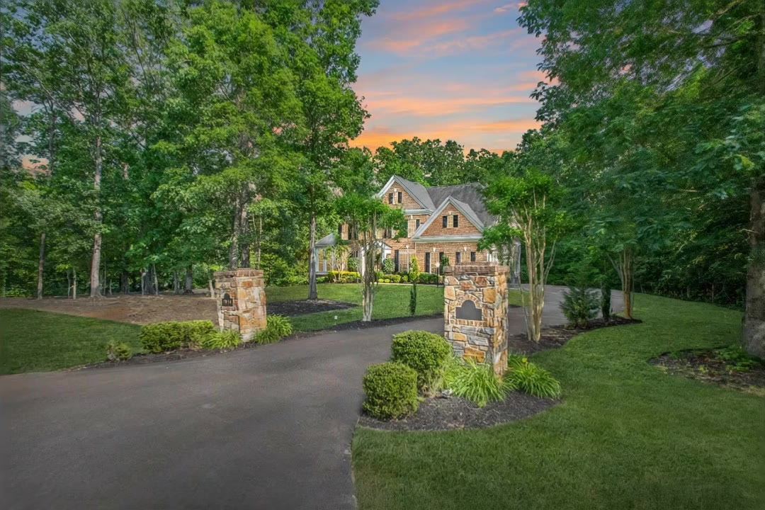 A Northern Virginia home sold by Kevin Bailey, framed by trees at golden hour